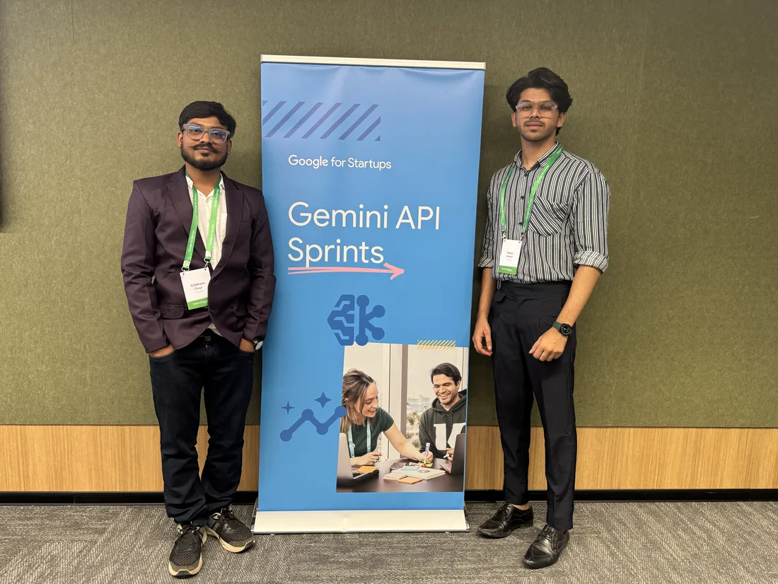 Siddhant Gour and a colleague beside the Gemini API Sprints banner